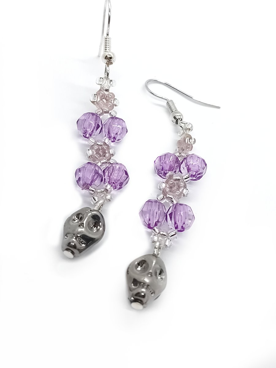 Purple and silver skull dangle earrings