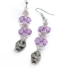 Purple and silver skull dangle earrings