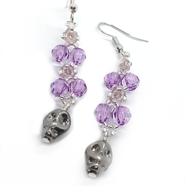 Purple and silver skull dangle earrings