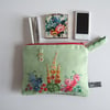 Cosmetics bag, pouch or make up bag made from cottage garden vintage embroidery.