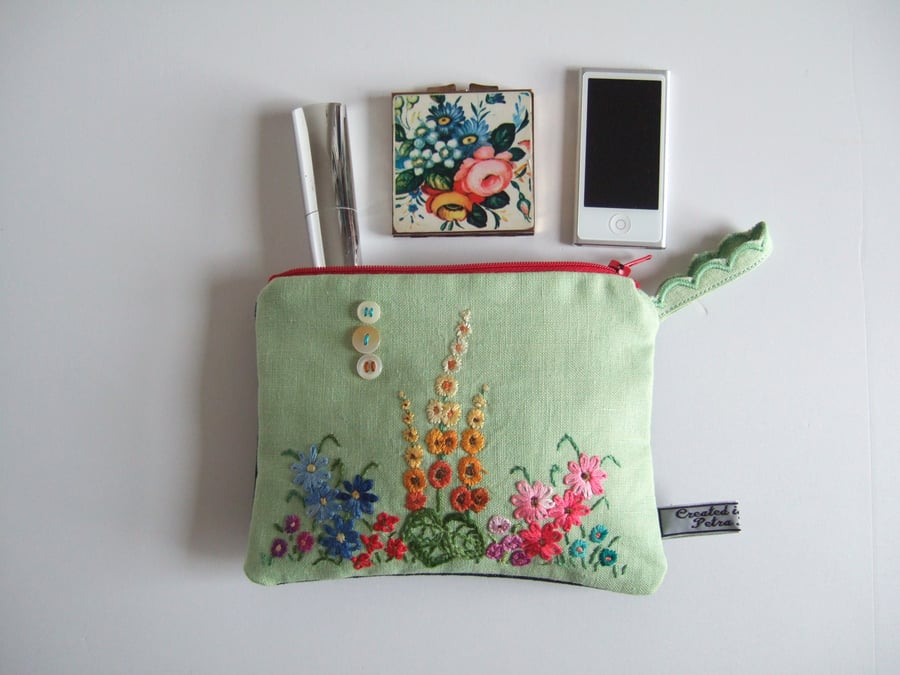 Cosmetics bag, pouch or make up bag made from cottage garden vintage embroidery.