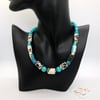 Black, white and blue patterned paper beaded necklace with turquoise separators