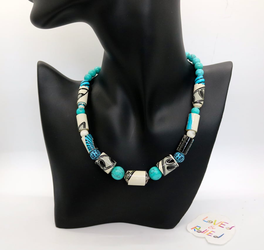 Black, white and blue patterned paper beaded necklace with turquoise separators