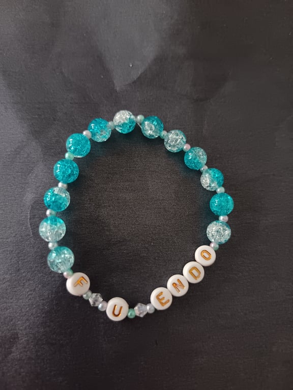 Elasticated blue and pastel beaded endometriosis letter bracelet