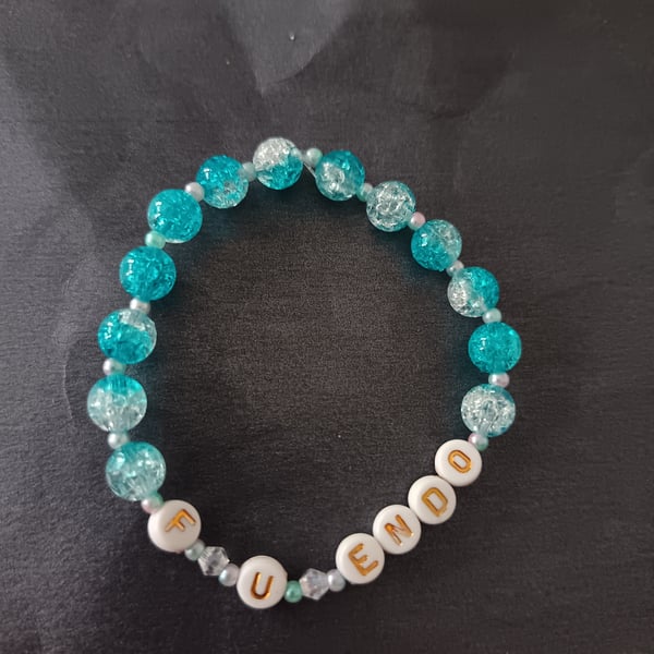 Elasticated blue and pastel beaded endometriosis letter bracelet