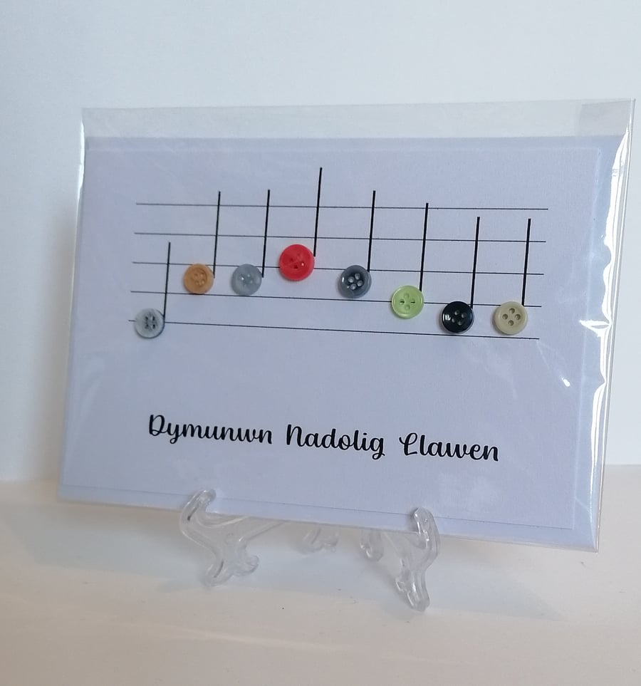 Dymunwyn Nadolig Llawen We wish you a Merry Christmas with music notes
