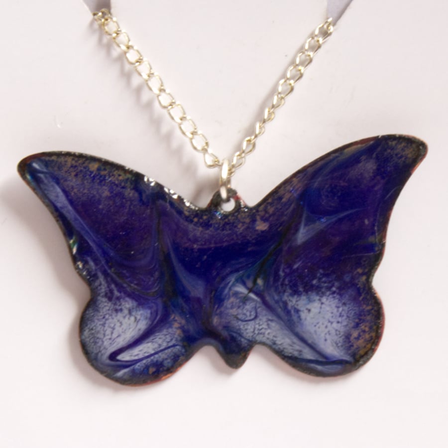 butterfly scrolled white over blue - pendant