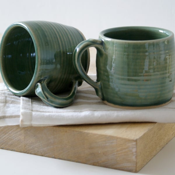 Two tankard style stoneware pottery tea mugs - glazed in forest green