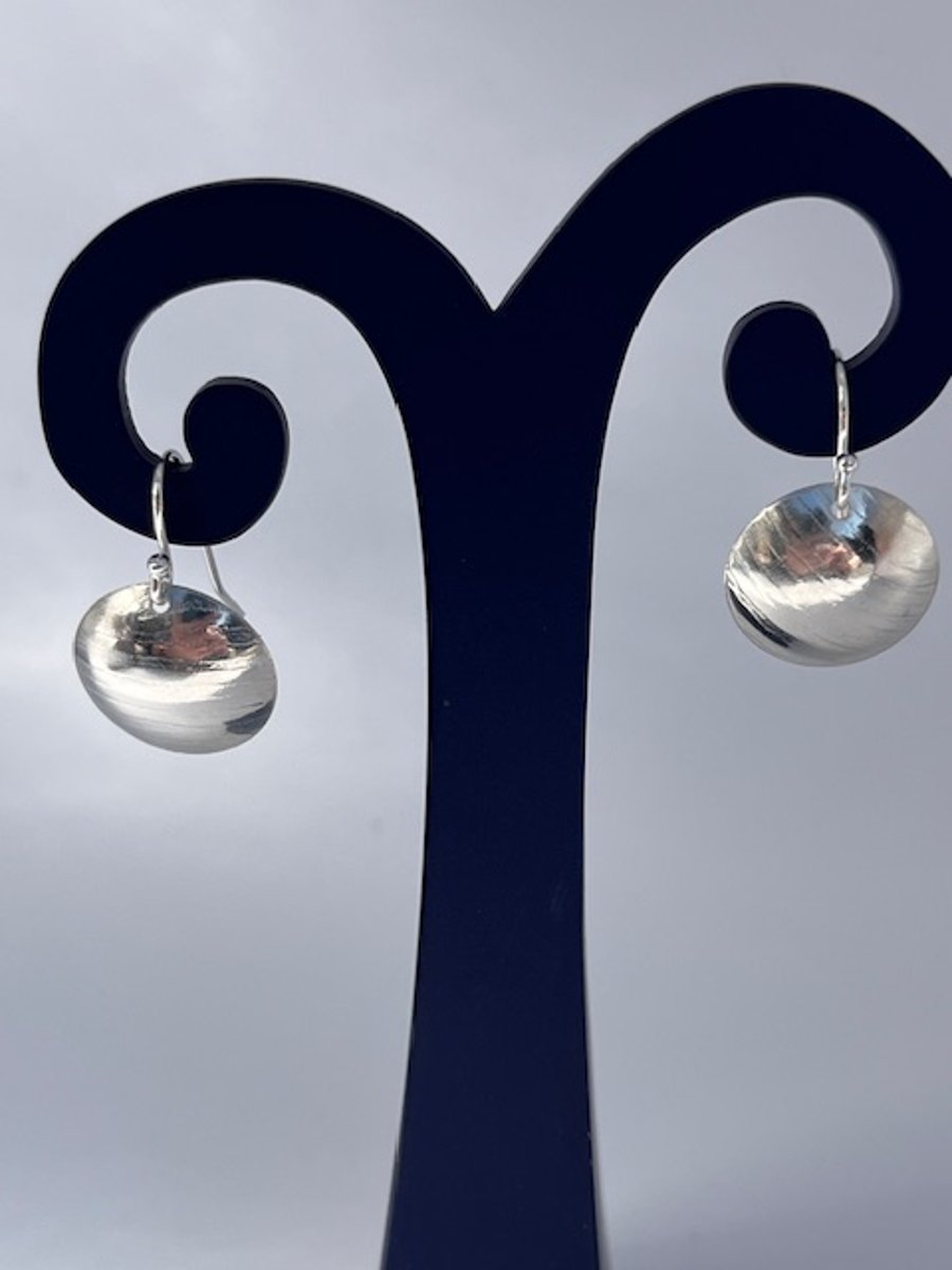 Silver dome earrings with a light hammered texture
