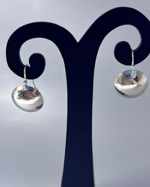 Silver dome earrings with a light hammered texture