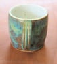 Stoneware pottery mug finished in a muli-colour green glaze - Image 4
