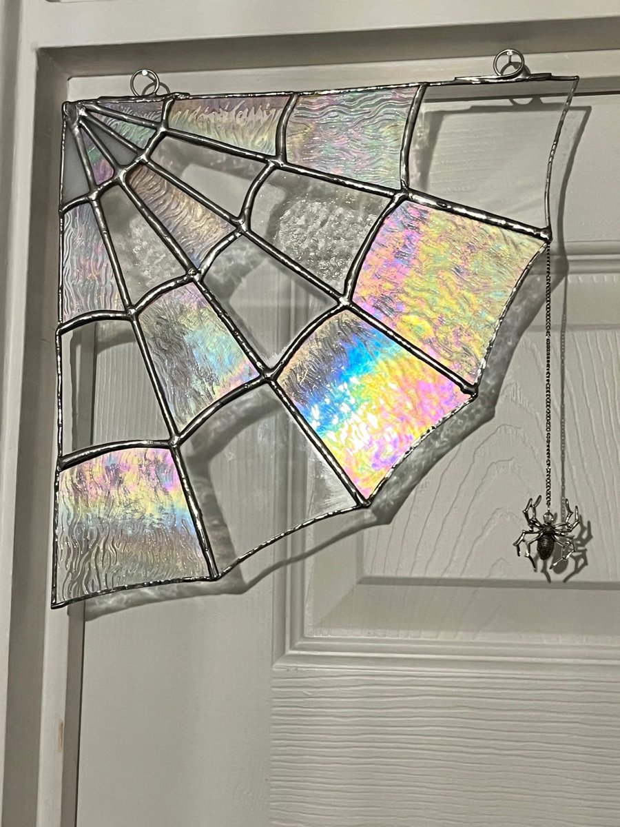 Large stained glass Spider web decoration with a hanging silver spider 10" x 10"