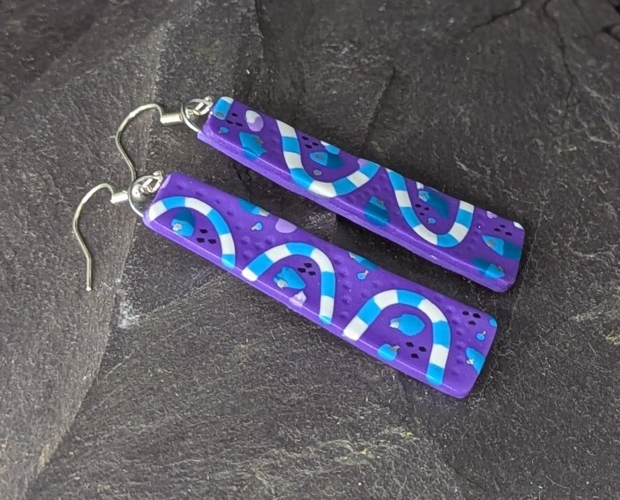 purple with blue waves, slim polymer clay earrings.