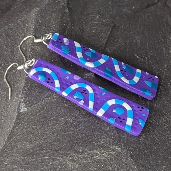 purple with blue waves, slim polymer clay earrings.