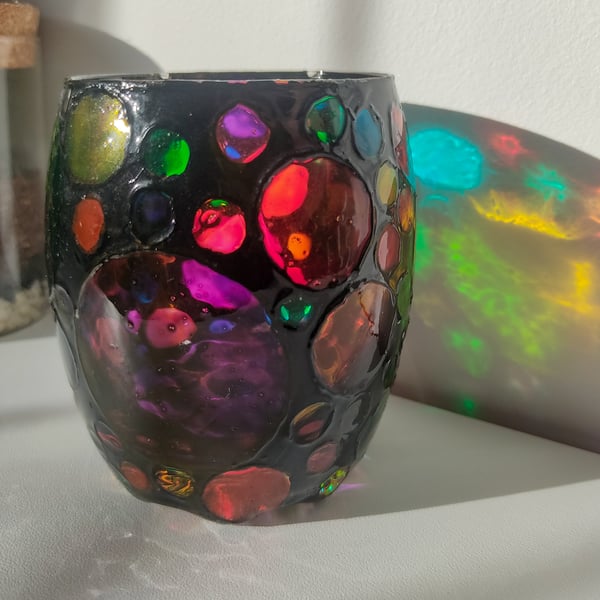 Stained glass effect painted tea light holder with multi-coloured circles 