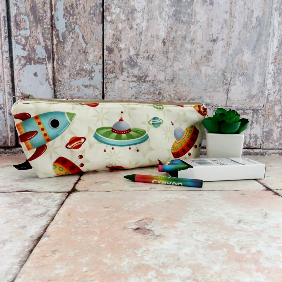  Pencil case in cute space ship fabric with free crayons.