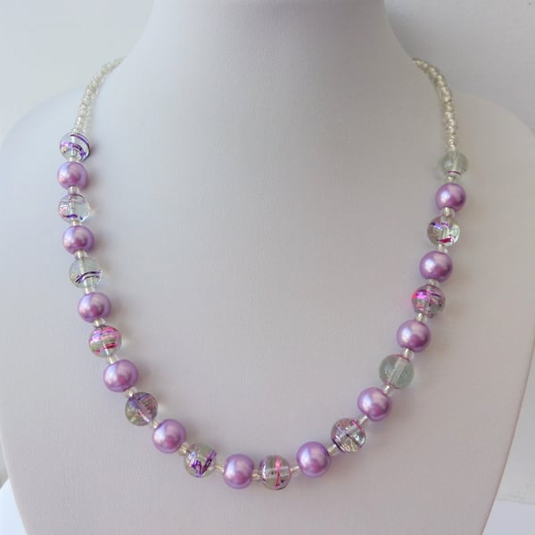 Purple pearl, purple and pink swirl and clear glass bead necklace.