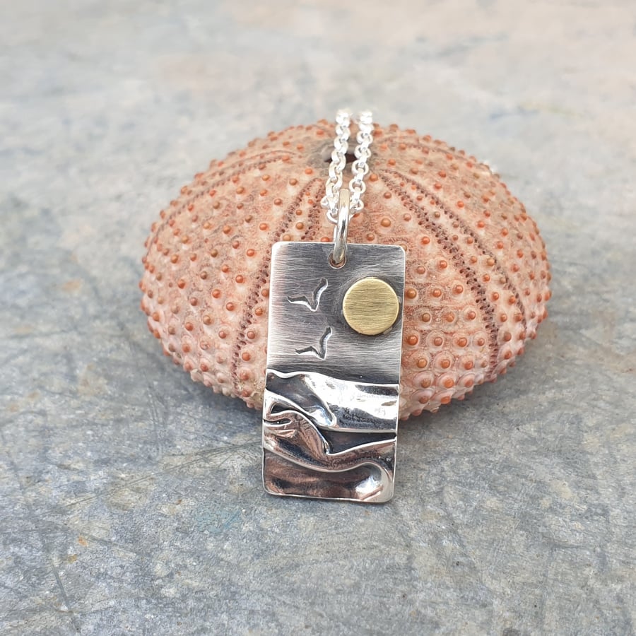 Silver beach, sea coast pendant, with brass sun and seagulls