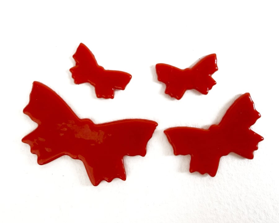 Four red Butterflies made with Bullseye 90coe glass