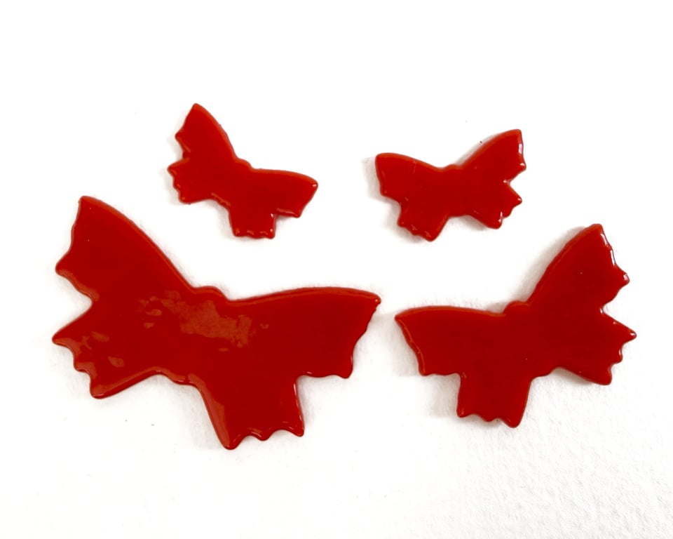 Four red Butterflies made with Bullseye 90coe glass