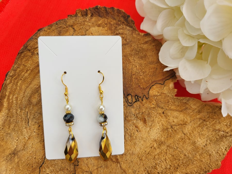 Elegant dangle earrings with antique gold teardrops