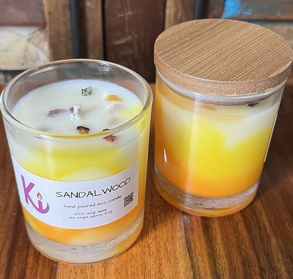 Sandalwood soy wax candle in a glass jar & decorated with real crystals