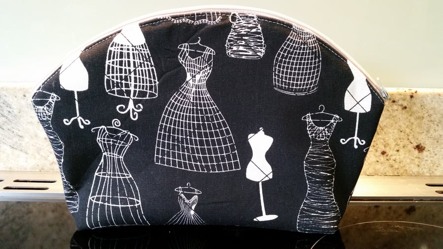 Wash bag or make up bag made from black white mannequin design fabric