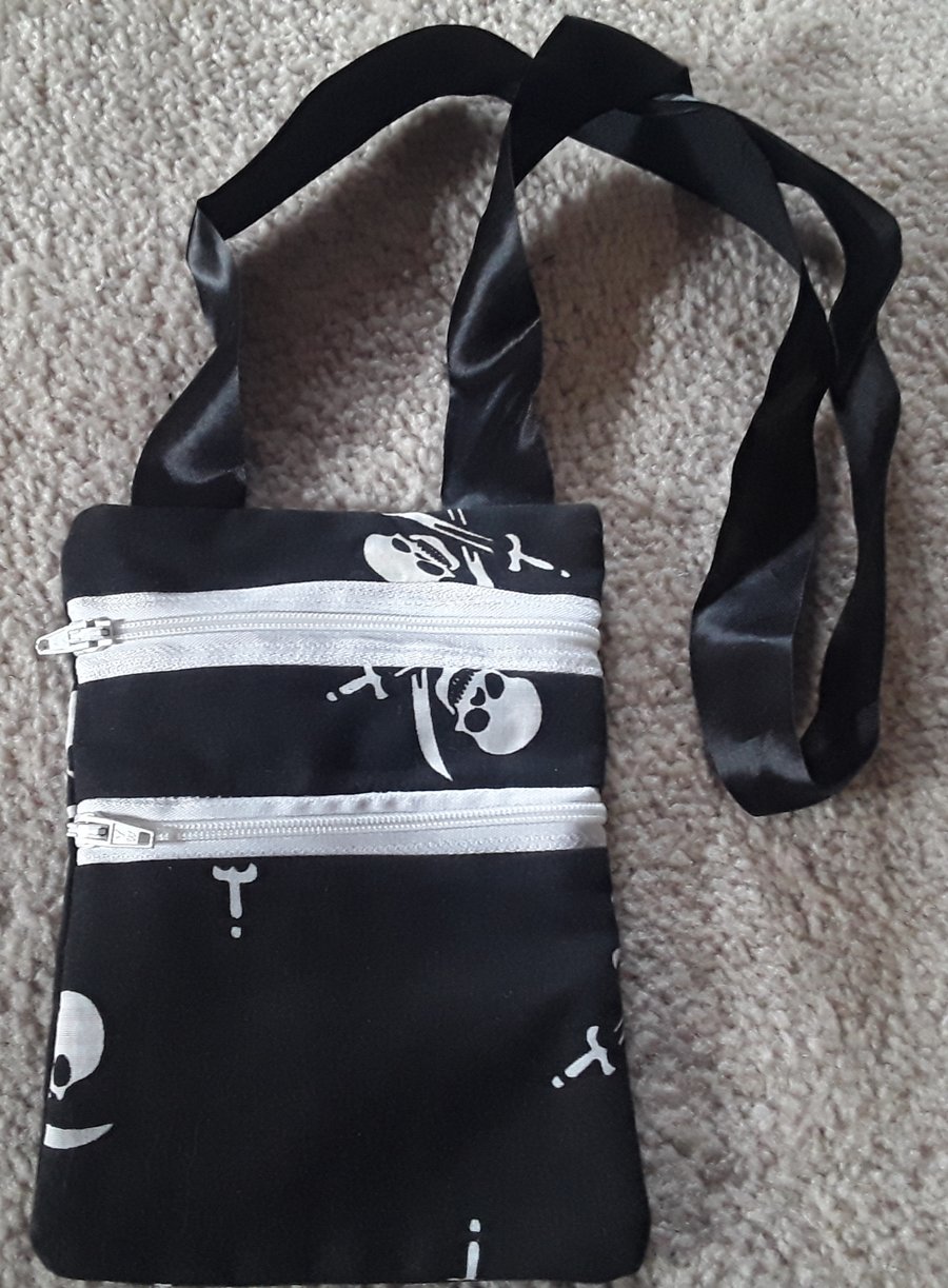 Round the neck, skull and crossbones money bag