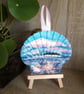 Pastel seascape handpainted shell wall decoration.  