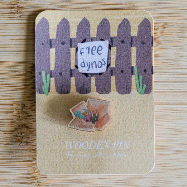 seconds -Free Dynosaurs. Dinosaurs in a box. Illustrated Wooden Pin badge 