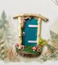 Handcrafted driftwood fairy door.