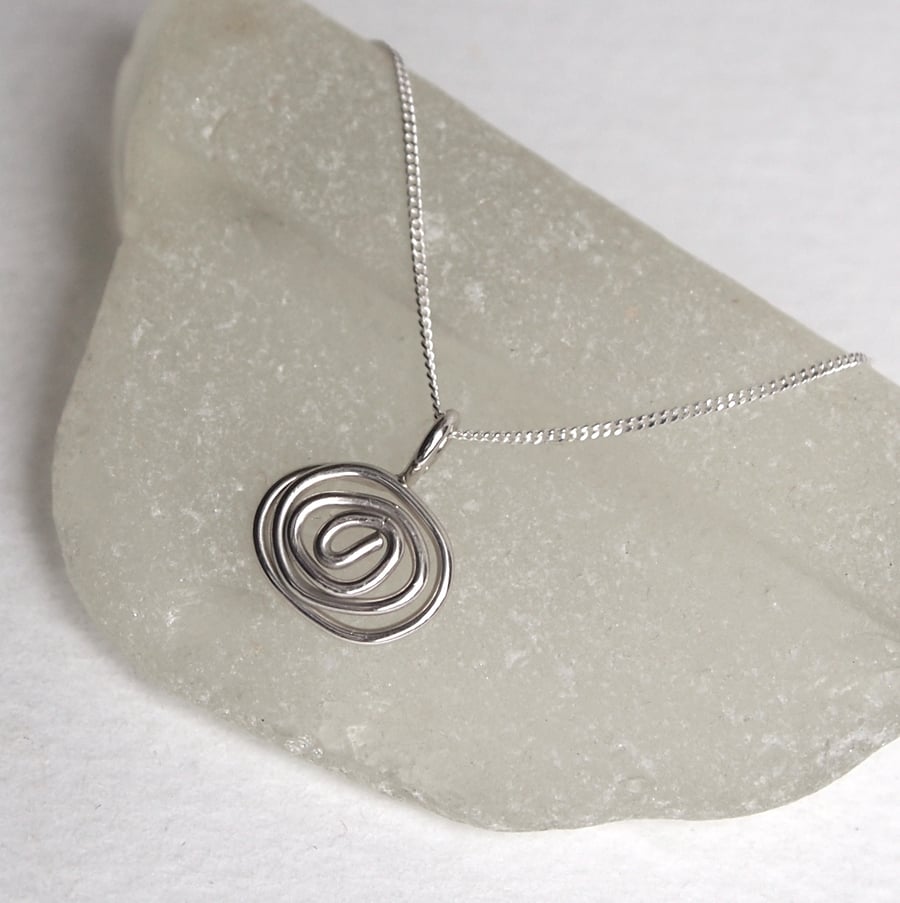 silver necklace with a twist