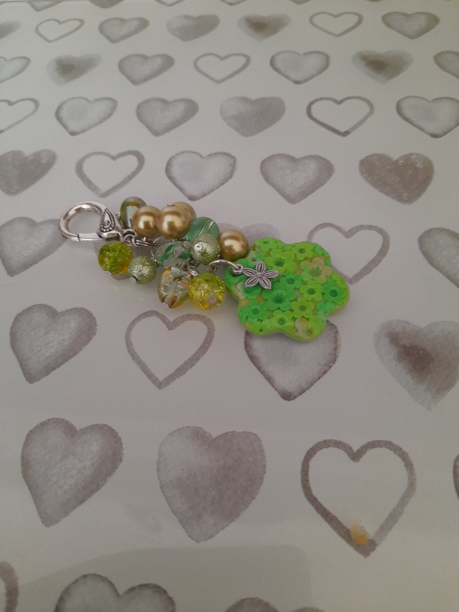 SHADES OF GREEN AND SILVER POLYMER CLAY FLOWER BAG CHARM.