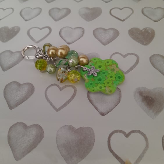 SHADES OF GREEN AND SILVER POLYMER CLAY FLOWER BAG CHARM.