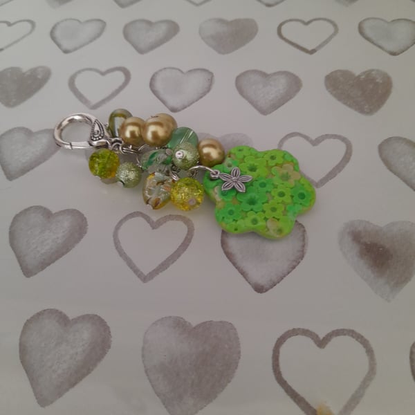 SHADES OF GREEN AND SILVER POLYMER CLAY FLOWER BAG CHARM.