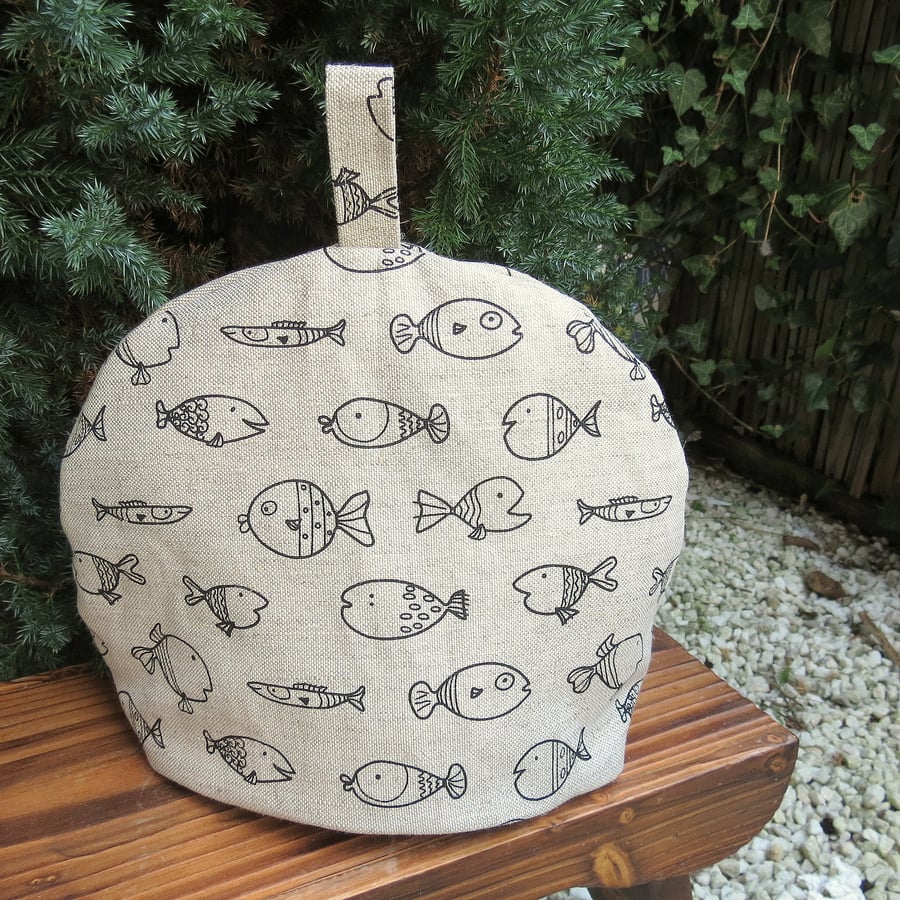 Fish.  A linen tea cosy, size medium.  To fit a 4 cup teapot.