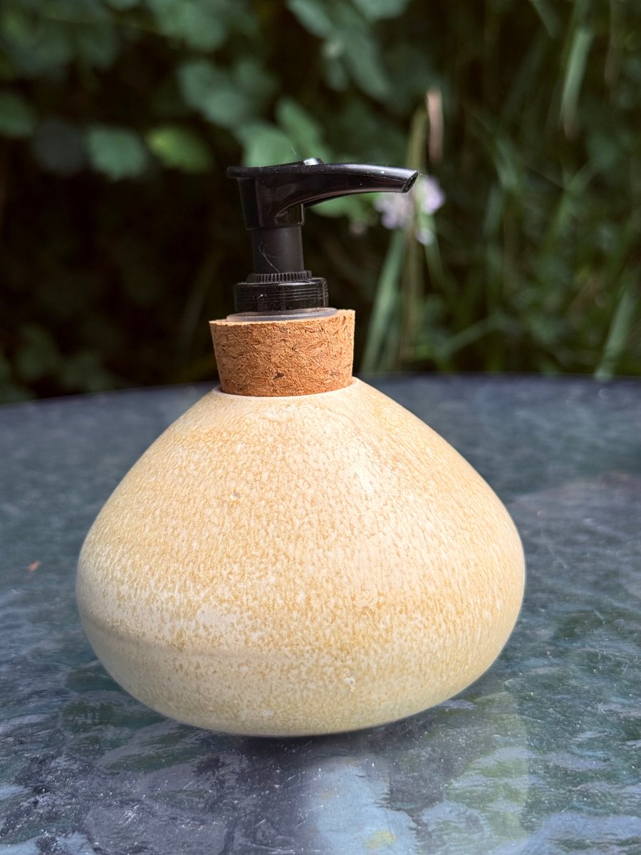 Hand thrown stoneware soap dispenser with pump. Creamy yellow colour