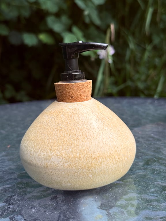 Hand thrown stoneware soap dispenser with pump. Creamy yellow colour