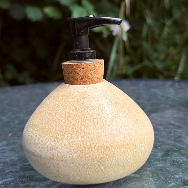 Hand thrown stoneware soap dispenser with pump. Creamy yellow colour