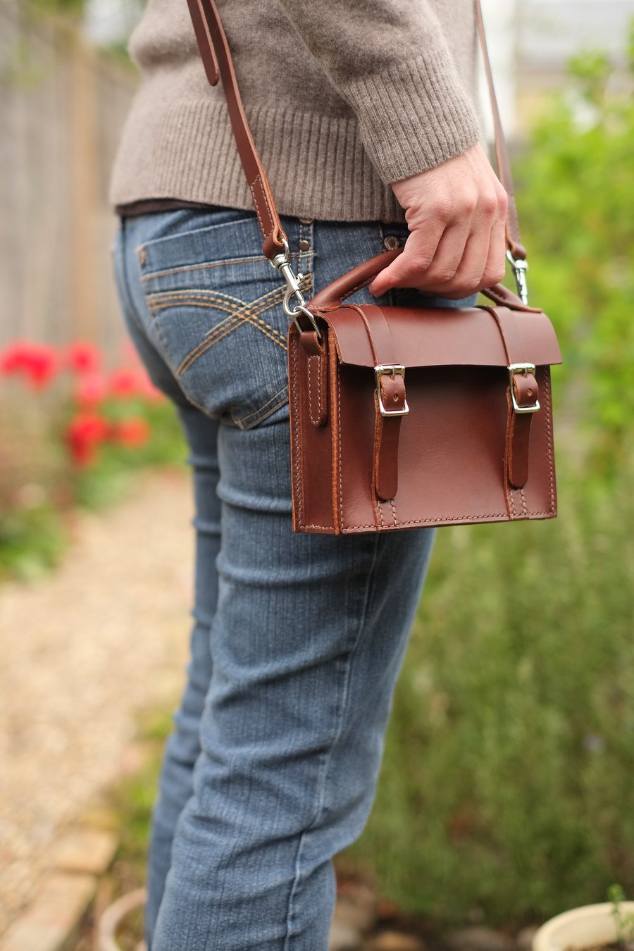 Mini satchel style hand bag with detachable shoulder strap