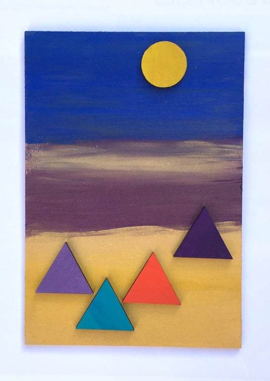 Pyramids against a blue, purple and gold background
