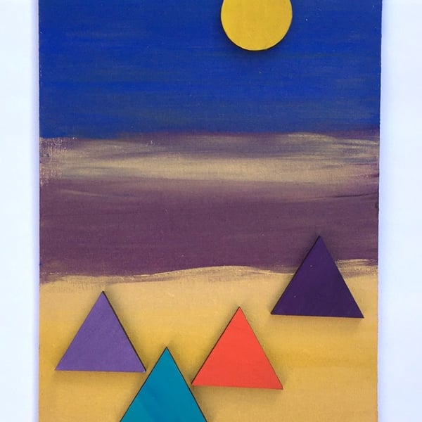 Pyramids against a blue, purple and gold background