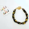 Africa inspired black yellow and gold paper beaded bracelet