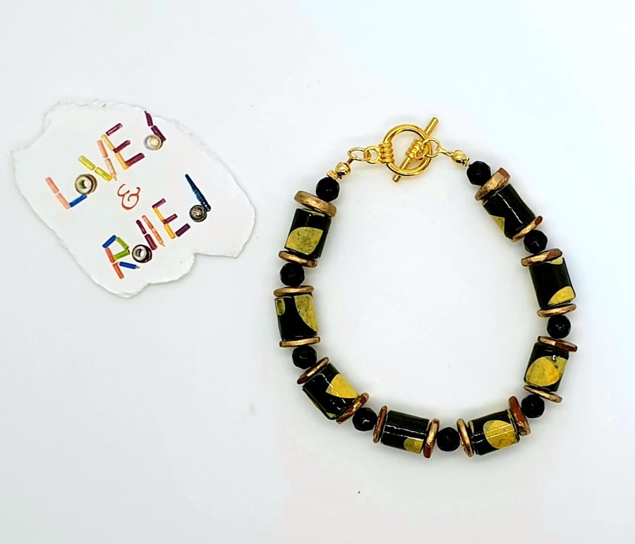 Africa inspired black yellow and gold paper beaded bracelet
