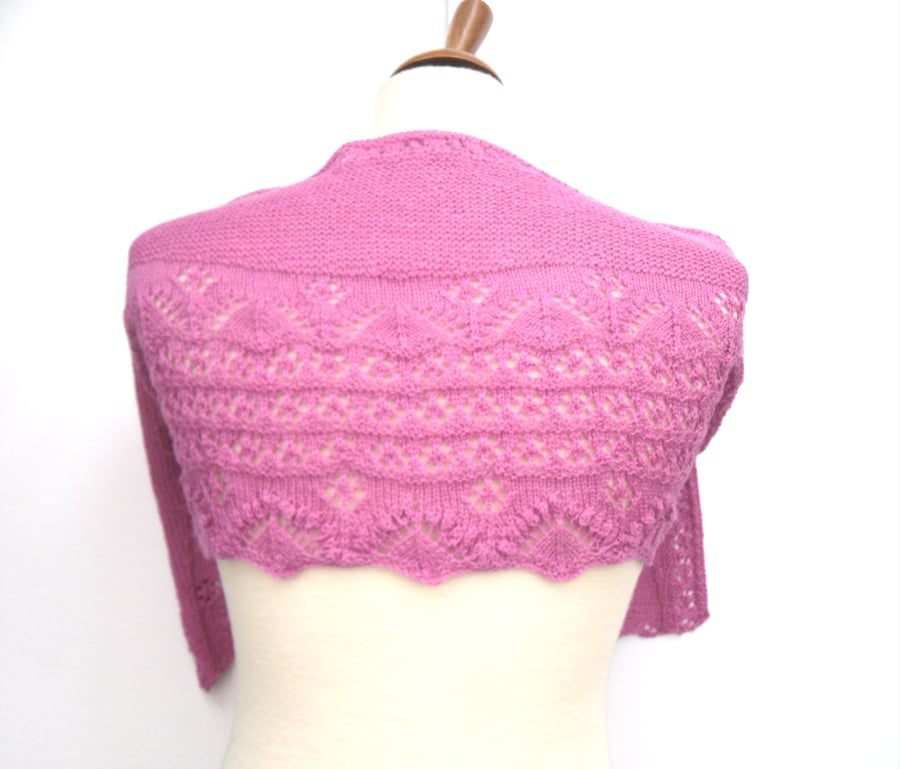 Crescent shaped pink hand knit shawl 