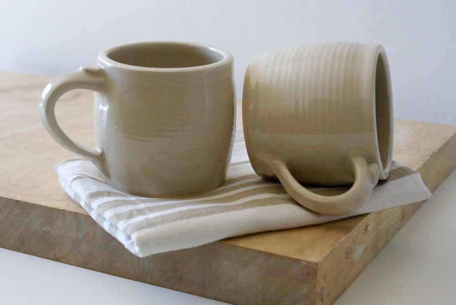 Two tankard style stoneware pottery tea mugs - glazed in simply clay