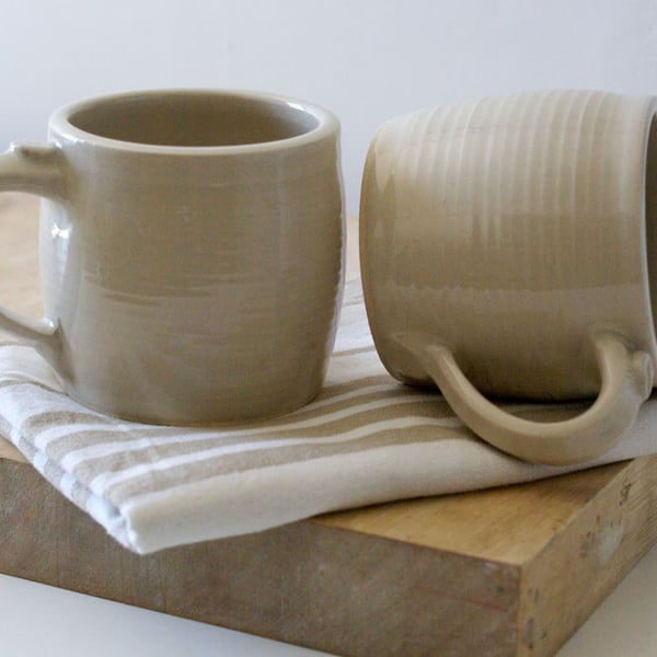 Two tankard style stoneware pottery tea mugs - glazed in simply clay