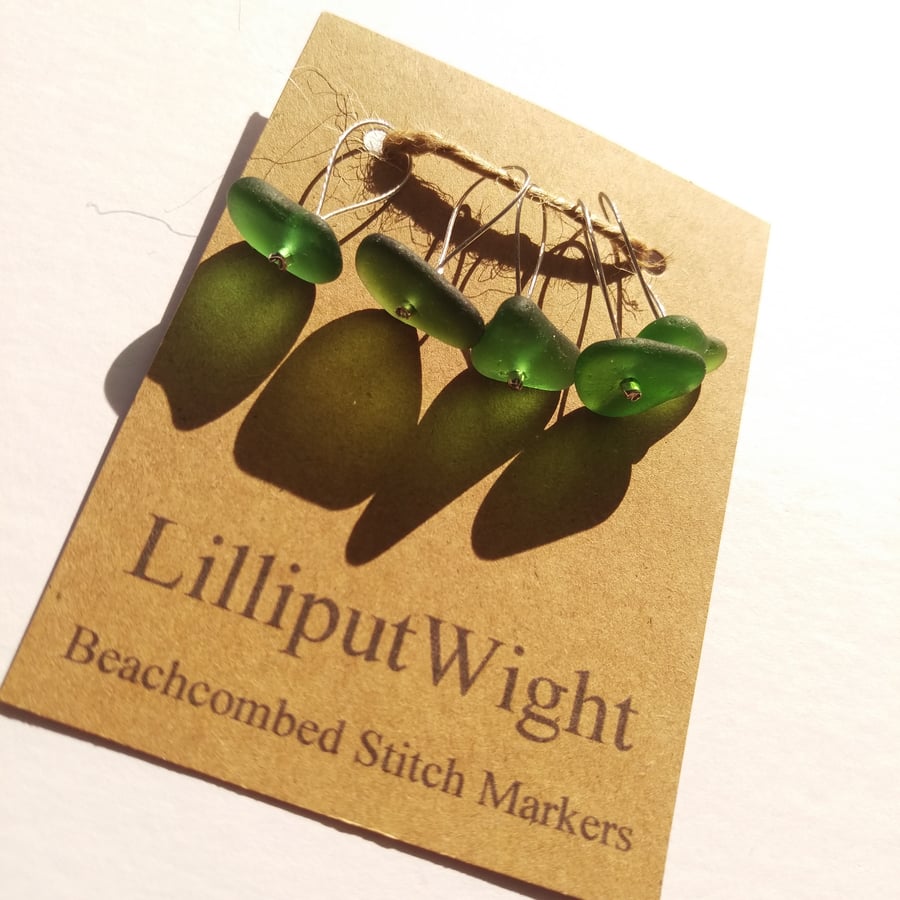 Five green sea glass stitch markers