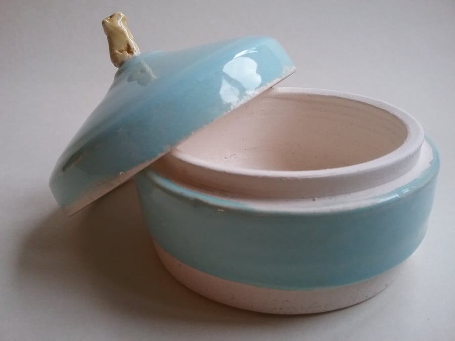 Small aqua hand made ceramic lidded pot with tiny labrador dog attached