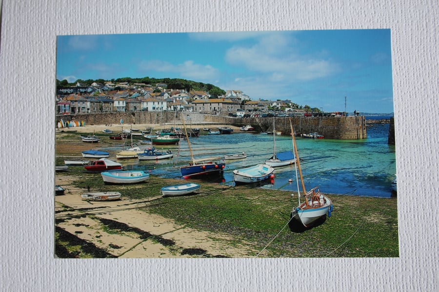 Photographic greetings card of Mousehole harbour at low tide.